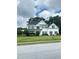 Beautifully landscaped two-story home with manicured lawn and a classic suburban appeal at 540 Langley Creek Dr, Loganville, GA 30052