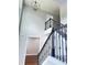 Bright foyer with soaring ceilings, a modern chandelier, and elegant staircase with iron spindles at 540 Langley Creek Dr, Loganville, GA 30052