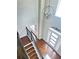 Foyer with staircase, hardwood floors, tall ceilings and view of the entrance and modern lighting fixture at 540 Langley Creek Dr, Loganville, GA 30052