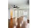 Spacious living room featuring hardwood floors and a modern ceiling fan at 540 Langley Creek Dr, Loganville, GA 30052