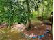 Private backyard with mature trees and a stepping stone path, ideal for outdoor enjoyment at 921 Hemingway Rd, Stone Mountain, GA 30088