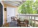 Cozy balcony with outdoor seating overlooking lush greenery at 1202 Countryside Pl, Smyrna, GA 30080