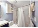 Bathroom with shower-tub combination, sliding barn door storage, and a modern vanity at 1202 Countryside Pl, Smyrna, GA 30080