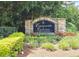 Community entrance sign surrounded by manicured landscaping and colorful flowers, inviting residents and visitors at 1202 Countryside Pl, Smyrna, GA 30080
