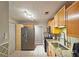 Functional kitchen featuring wood cabinetry, stainless steel appliances, and tiled backsplash at 1202 Countryside Pl, Smyrna, GA 30080