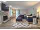 Spacious living room with a fireplace, plush seating, and modern decor at 1202 Countryside Pl, Smyrna, GA 30080