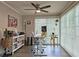 Home office space featuring a large window for natural light, a ceiling fan and built-in bookshelf at 1202 Countryside Pl, Smyrna, GA 30080