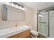 Bright bathroom featuring a modern vanity, stylish mirror, and a glass-enclosed shower at 170 Boulevard Se # E120, Atlanta, GA 30312
