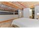 Bright bedroom featuring an open closet, hardwood floors, industrial ceiling, and a sleek wardrobe at 170 Boulevard Se # E120, Atlanta, GA 30312