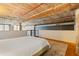 Spacious bedroom with hardwood floors, industrial ceiling, and modern, neutral decor at 170 Boulevard Se # E120, Atlanta, GA 30312