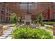 Pergola covered seating area with fireplace and lush landscaping at 170 Boulevard Se # E120, Atlanta, GA 30312