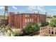 Expansive brick exterior of building with lots of windows and a water tower, surrounded by beautiful trees at 170 Boulevard Se # E120, Atlanta, GA 30312