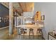 Modern kitchen boasts stainless steel appliances, light wood cabinets, bar seating, and a spiral staircase at 170 Boulevard Se # E120, Atlanta, GA 30312