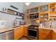 Updated kitchen with stainless steel appliances, open shelving, and modern countertops at 170 Boulevard Se # E120, Atlanta, GA 30312