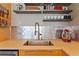 Modern kitchen features stainless steel sink, modern faucet and stainless backsplash at 170 Boulevard Se # E120, Atlanta, GA 30312