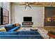 Bright living room with high ceilings, exposed brick, large windows, modern décor, and an open dining area at 170 Boulevard Se # E120, Atlanta, GA 30312
