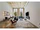 Bright, open living room featuring high ceilings, large windows, exposed brick, and modern stylish decor at 170 Boulevard Se # E120, Atlanta, GA 30312