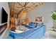 Bright living room with open floor plan featuring high ceilings, exposed brick, modern decor, and an adjacent kitchen at 170 Boulevard Se # E120, Atlanta, GA 30312