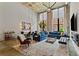 Bright, open living room with high ceilings, exposed brick, large windows, and stylish modern decor at 170 Boulevard Se # E120, Atlanta, GA 30312