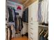 Well-organized walk-in closet with custom shelving, hanging rods, and ample storage space at 170 Boulevard Se # E120, Atlanta, GA 30312