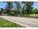 Scenic view of the ranch with well-maintained fences, landscaping, and multiple structures at 677 Panola Rd, Ellenwood, GA 30294