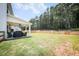 Expansive fenced backyard with a covered patio, perfect for outdoor activities and entertaining guests at 93 Oakdale Way, Temple, GA 30179