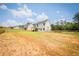 Huge backyard with a covered patio and fencing, perfect for recreation and outdoor living at 93 Oakdale Way, Temple, GA 30179