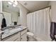Bathroom featuring granite countertops, white cabinetry, and a shower with a white shower curtain at 93 Oakdale Way, Temple, GA 30179