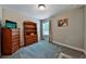 Bedroom with carpet, natural light, and wooden dressers for a cozy atmosphere at 93 Oakdale Way, Temple, GA 30179