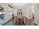 Cozy dining room filled with light, adjacent to the kitchen and overlooking the back yard at 93 Oakdale Way, Temple, GA 30179