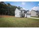 Charming two-story home featuring a well-manicured lawn, inviting front porch, and a two-car garage at 93 Oakdale Way, Temple, GA 30179
