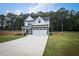 Charming two-story home featuring a well-manicured lawn, inviting front porch, and a two-car garage at 93 Oakdale Way, Temple, GA 30179