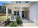 Inviting front porch featuring rocking chairs and space for outdoor seating, enhancing curb appeal at 93 Oakdale Way, Temple, GA 30179