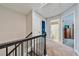 Upstairs carpeted hallway with access to bedrooms, bathroom, and a linen closet at 93 Oakdale Way, Temple, GA 30179