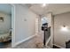 Second-floor hallway with carpet, railing, and views of bedrooms and living spaces at 93 Oakdale Way, Temple, GA 30179