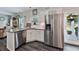 Well-appointed kitchen featuring a granite countertop island and stainless steel appliances at 93 Oakdale Way, Temple, GA 30179