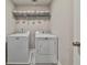Laundry room featuring a washer and dryer, offering convenient space for laundry tasks at 93 Oakdale Way, Temple, GA 30179