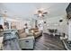 Cozy living room adjacent to the kitchen with hardwood flooring and neutral decor throughout at 93 Oakdale Way, Temple, GA 30179