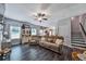 Spacious living area with hardwood floors, neutral paint, and open staircase to the upper level at 93 Oakdale Way, Temple, GA 30179
