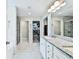 Bright main bathroom with double sinks, granite counters, walk-in shower, and a separate water closet at 93 Oakdale Way, Temple, GA 30179