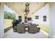 Cozy covered patio with outdoor seating, grill, and string lights, perfect for entertaining at 93 Oakdale Way, Temple, GA 30179
