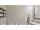 This powder room features a modern sink with a framed mirror, complemented by stylish fixtures and decor at 93 Oakdale Way, Temple, GA 30179