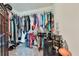 Well-organized walk-in closet with racks and shelving, ideal for storing clothing and accessories at 93 Oakdale Way, Temple, GA 30179