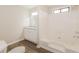 Clean bathroom with white cabinets, granite countertops, and a tub-shower combo at 4100 Summer Wood Dr, Snellville, GA 30039