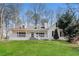 Charming white two-story home featuring a welcoming front porch and well-manicured lawn at 4100 Summer Wood Dr, Snellville, GA 30039