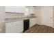 Modern kitchen featuring white cabinets, granite countertops, and updated appliances at 4100 Summer Wood Dr, Snellville, GA 30039