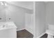 Neutral bathroom with a vanity and sink combination as well as a toilet and bathtub at 800 Tradd Ct, Stone Mountain, GA 30087
