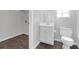 The updated bathroom is equipped with a vanity, toilet, and closet storage at 800 Tradd Ct, Stone Mountain, GA 30087