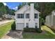 Charming two-story home featuring a cozy front porch, attached garage, and well-maintained landscaping at 800 Tradd Ct, Stone Mountain, GA 30087