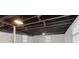 Spacious basement featuring painted cinder block walls and exposed ceiling with lighting at 1349 Lockhaven Sw Cir, Atlanta, GA 30311